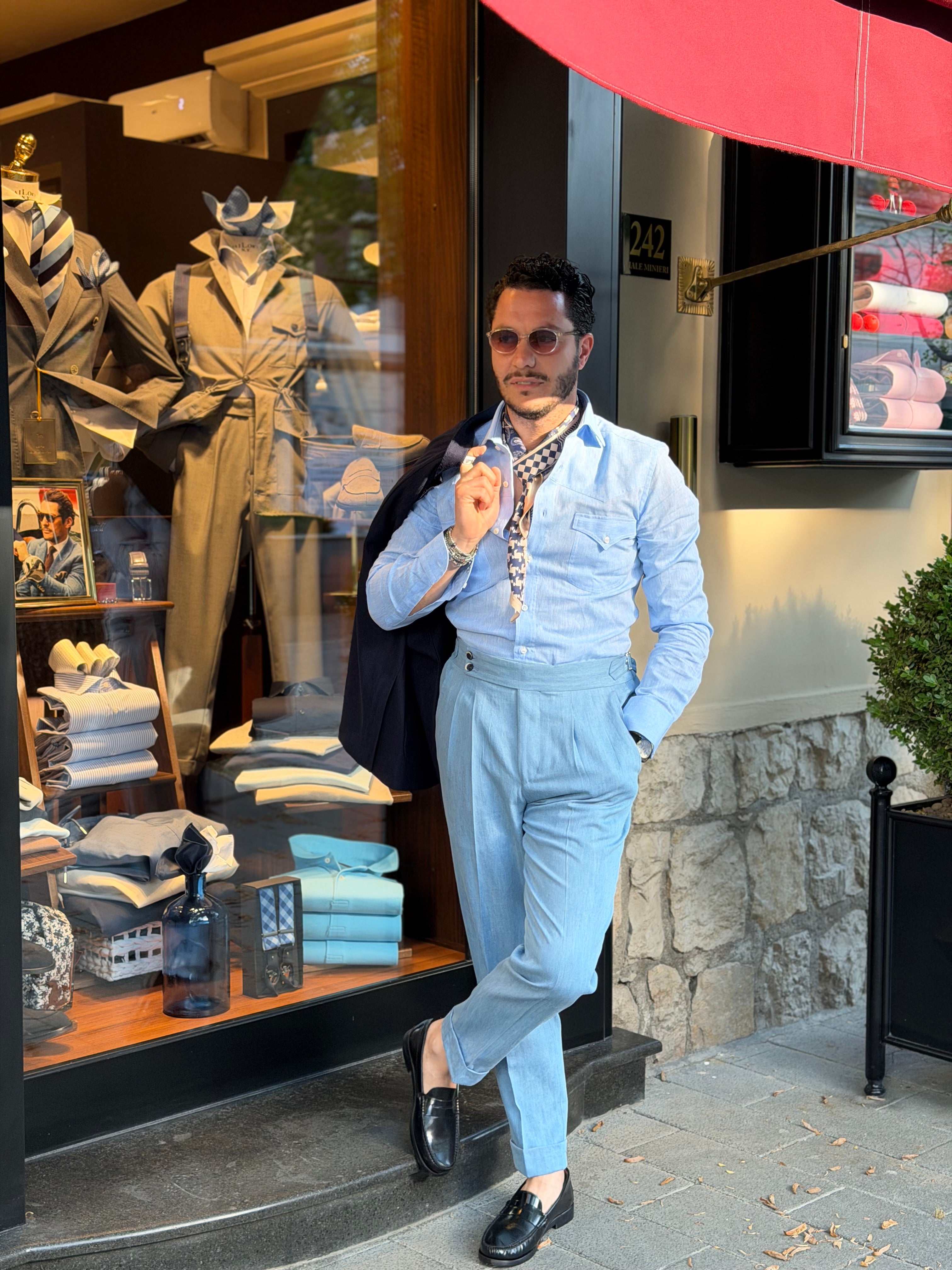Jeans vita alta con regolatori